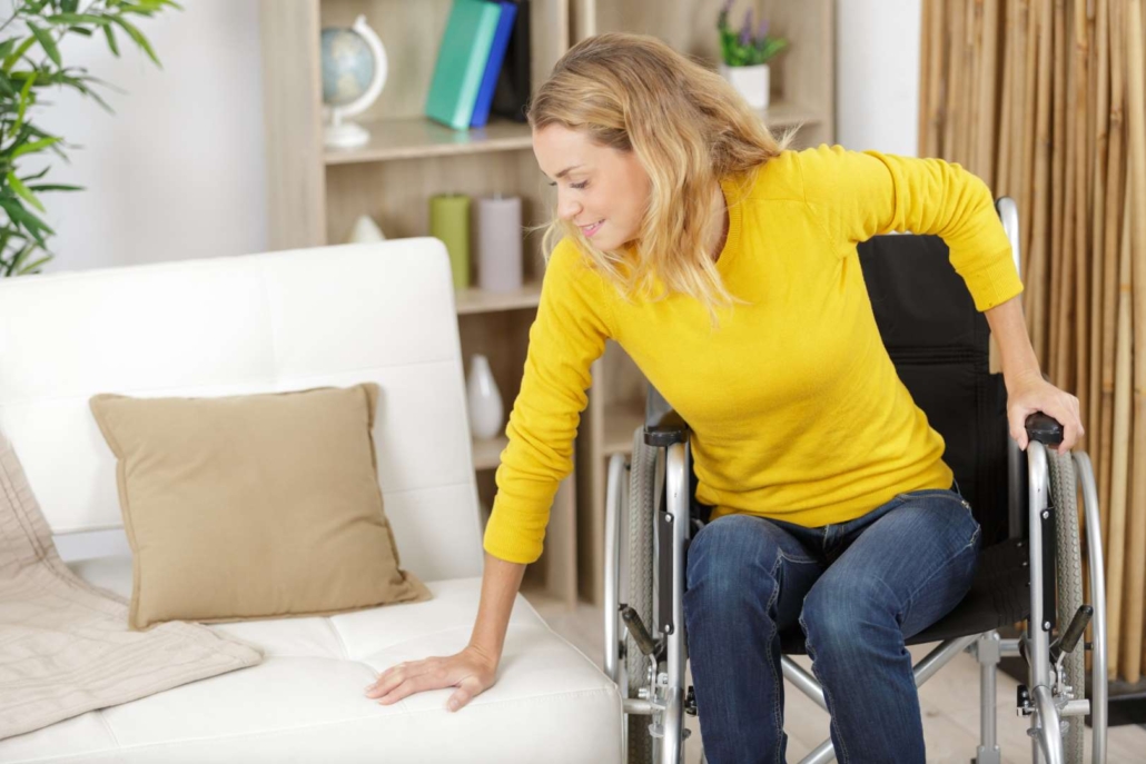 Young Woman In Wheelchair At Home